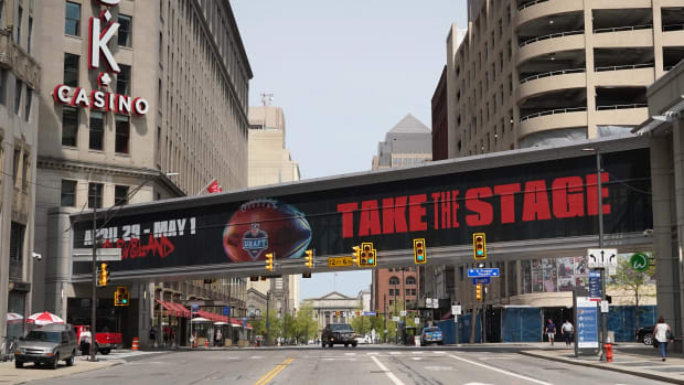 Apr 28, 2021; Cleveland, Ohio, United States; A pedestrian bridge with the words \"Take the Stage\" prior to the 2021 NFL Draft at the intersection of Prospect Ave and Ontario St. in downtown. Mandatory Credit: Kirby Lee-USA TODAY Sports